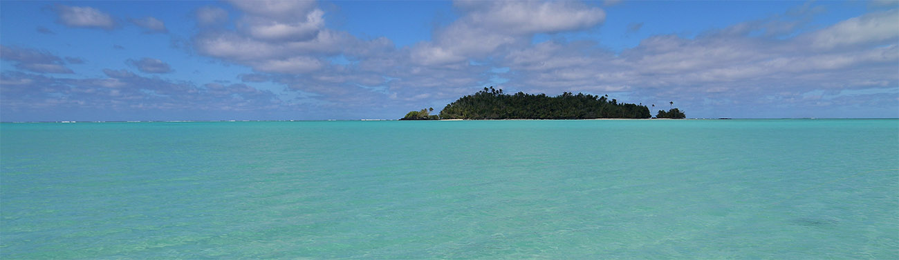 A small islandin the Cook Islands, tropical sea and sky 