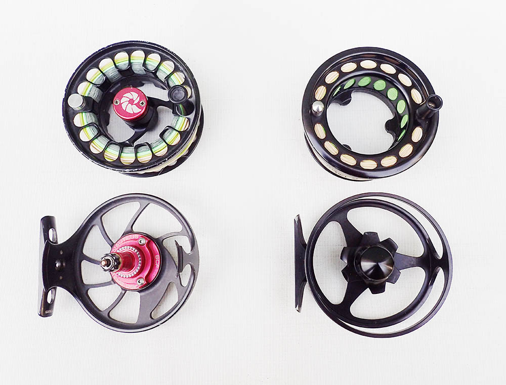 Full cage and reduced cage reels on a pale white background