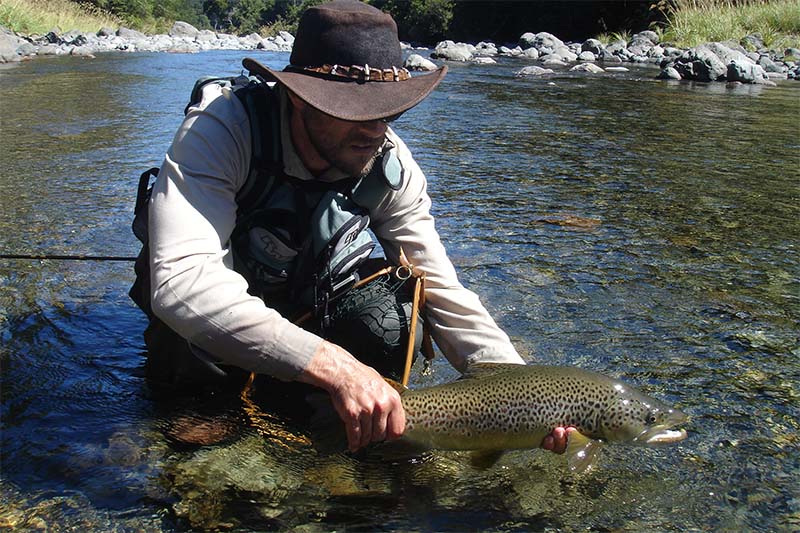 Fisherman holding trout