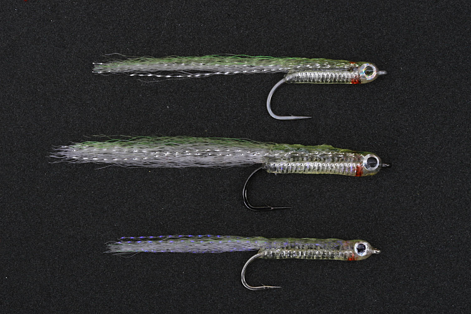 Three different sizes of the jelly belly minnow fly