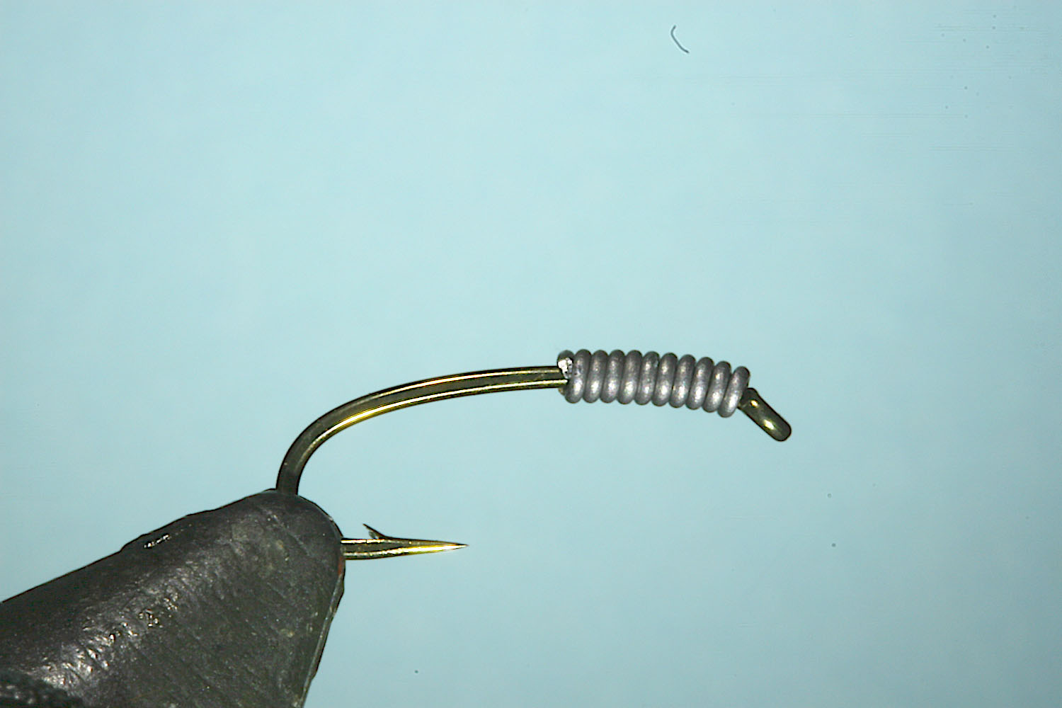 Step 1 of tying sequence for jelly crimp nymph fly