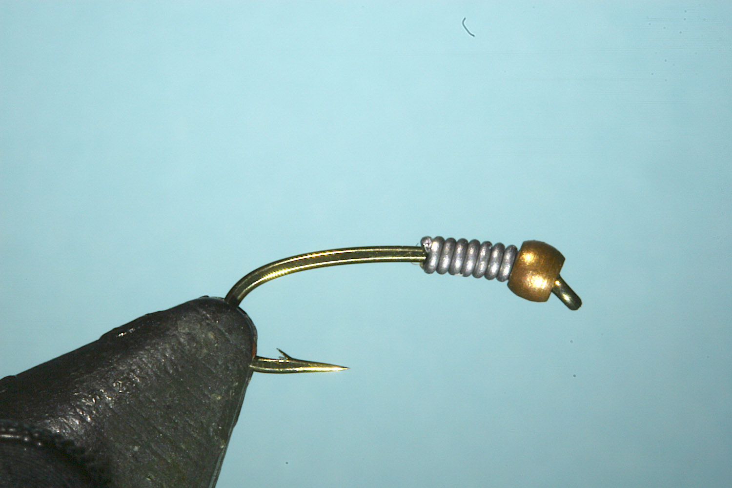 Step 2 of tying sequence for jelly crimp nymph fly