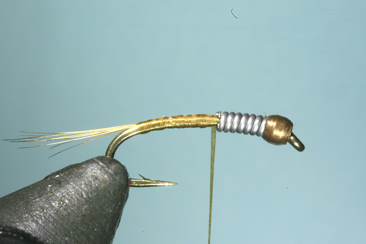 Step 3 of tying sequence for jelly crimp nymph fly