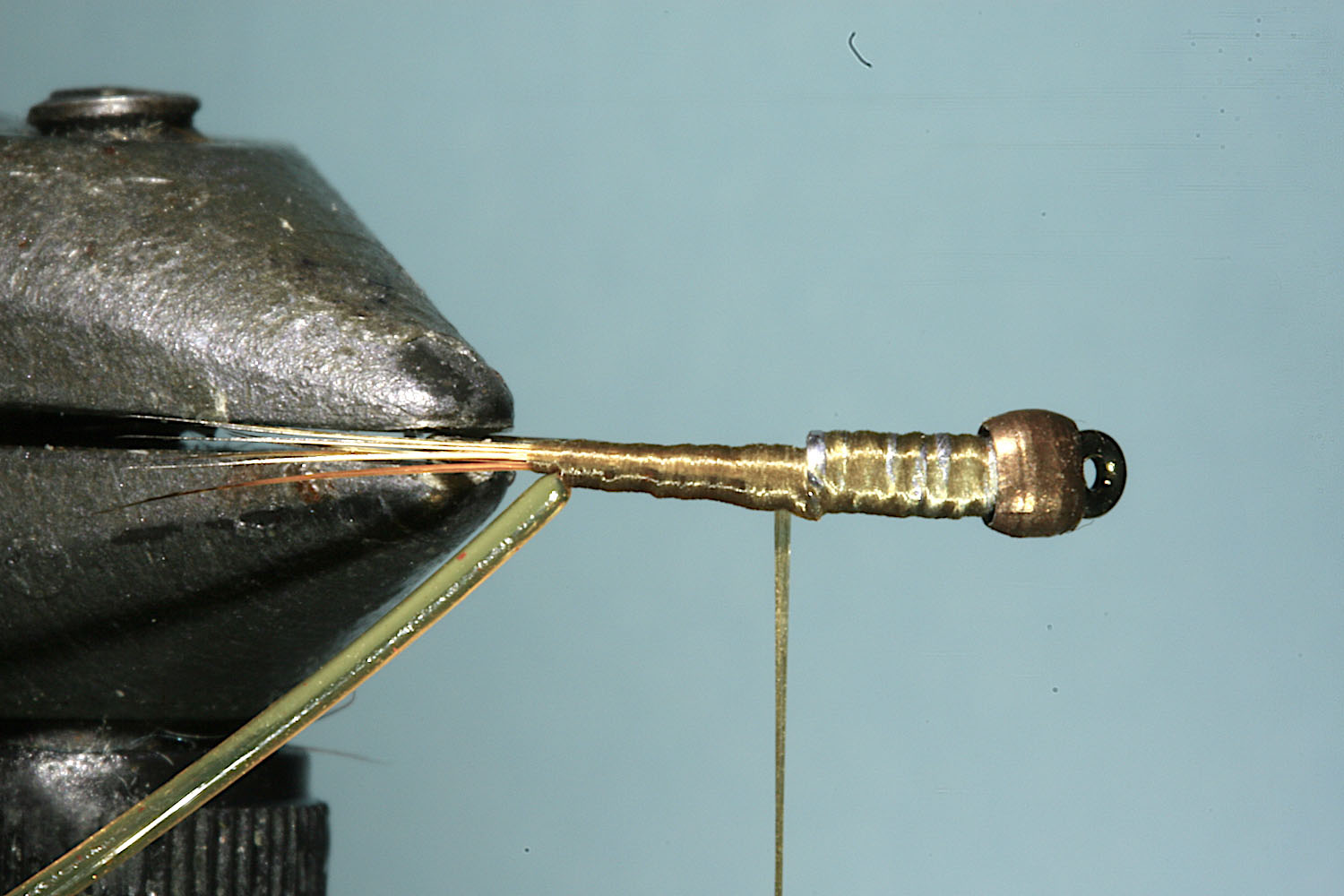 Step 4 of tying sequence for jelly crimp nymph fly