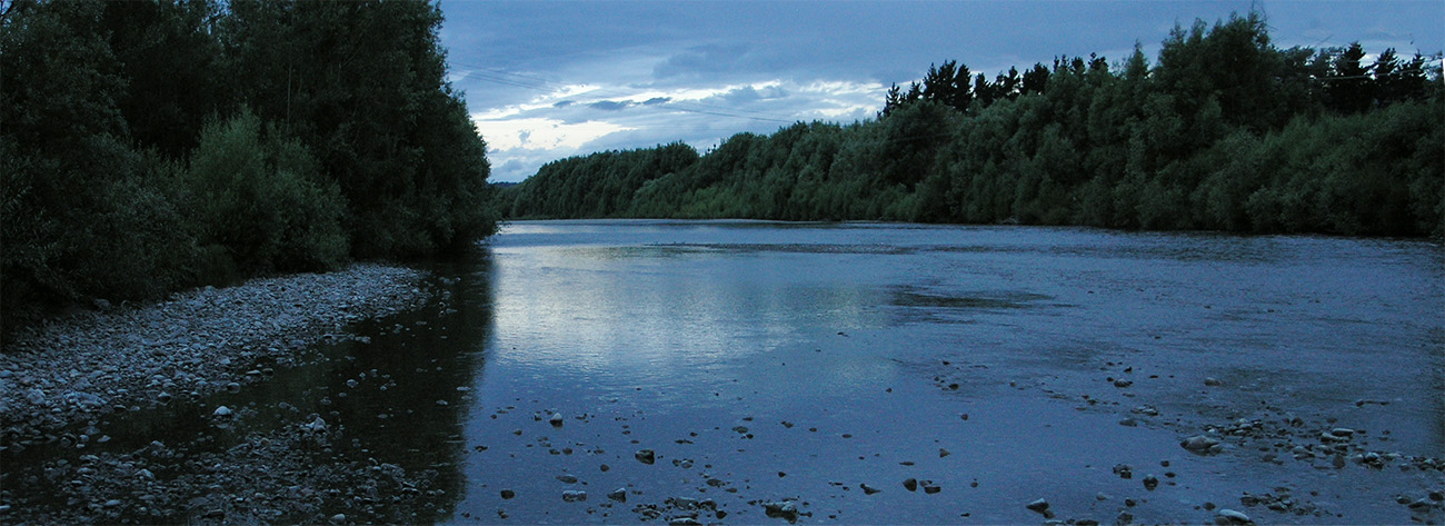 The wide Hutt River, New Zealand, after dusk